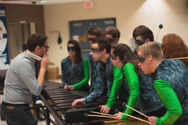 A group of students playing percussion.
