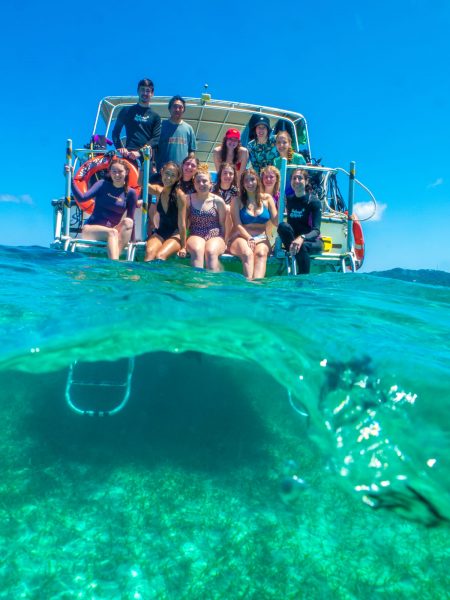 Iowa State students on boat, blue-green waters.