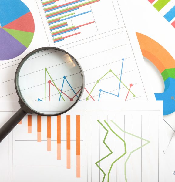 Magnifying glass and charts